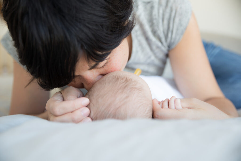 mom kissing baby boy's head family home session sf bay area