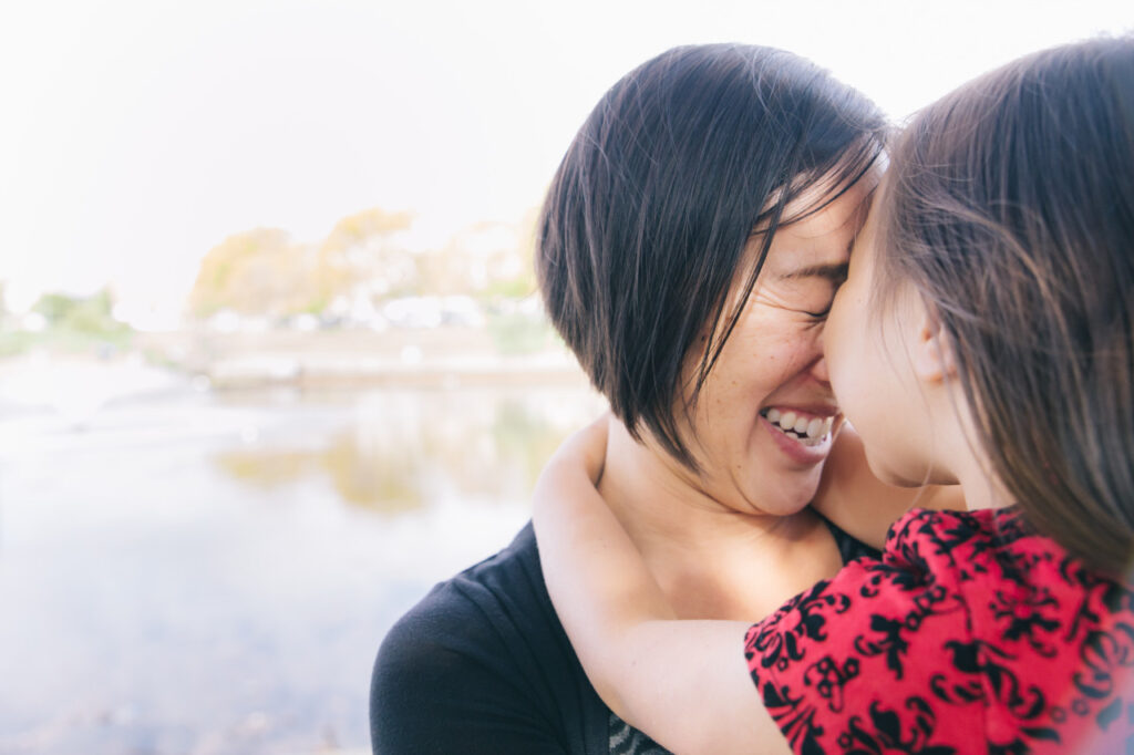 mother and daughter laughing candidly family session lake merritt sf east bay area oakland