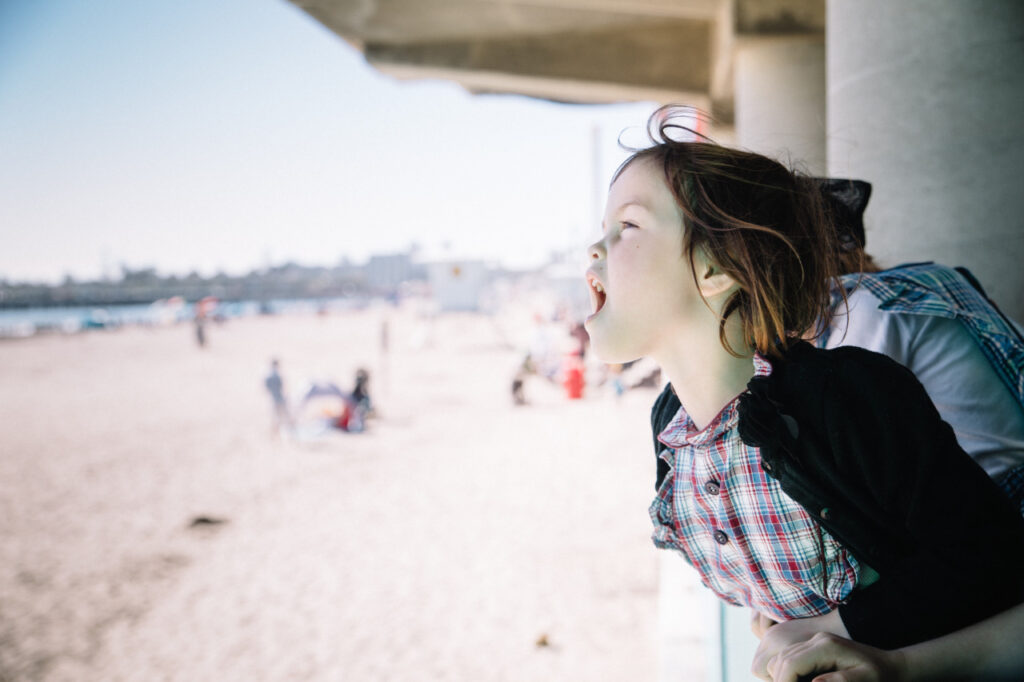 young girl having fun on beach boardwalk santa cruz sf bay area