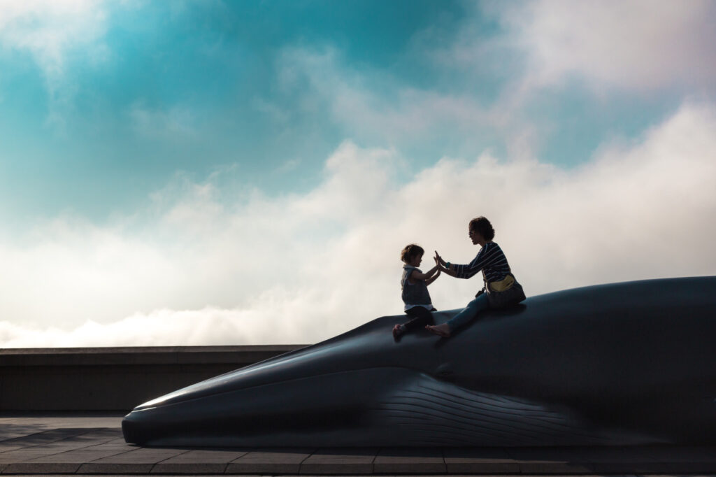 silhouette of mother and daughter playing patty cake lawrence hall of science berkeley sf bay area