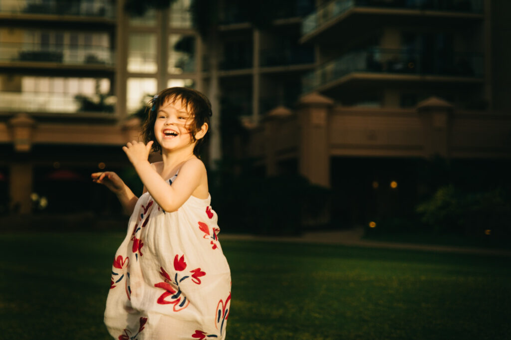 young girl running in field family session sf bay area