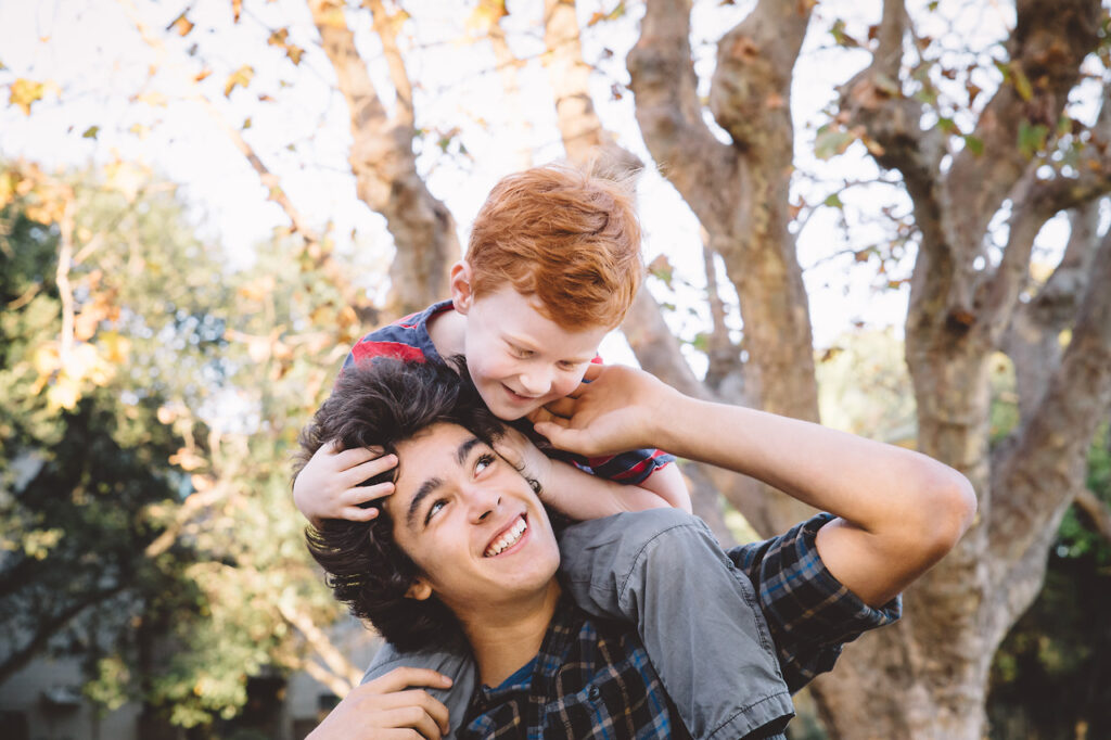 san-francisco-family-photographer-carmen-dunham-photography-KP2 teenage boy and young brother connecting, having fun at crab cove beach alameda