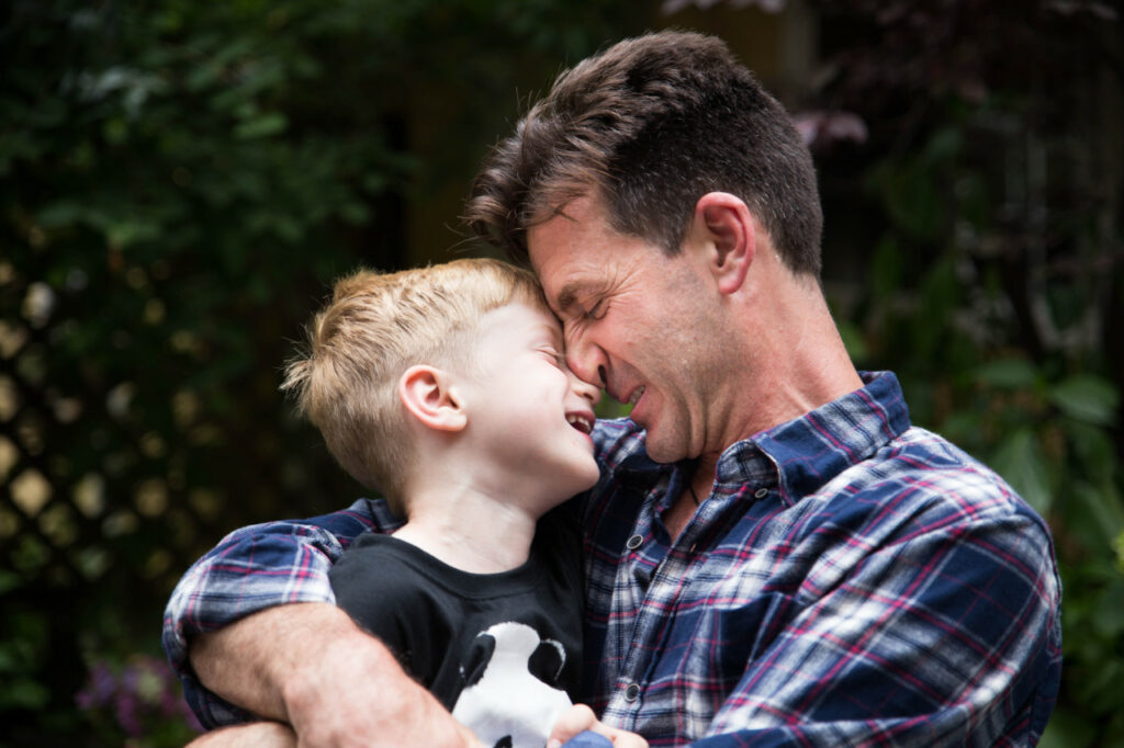 dad and son bonding laughing hugging family session sf bay area russian creek cazadero