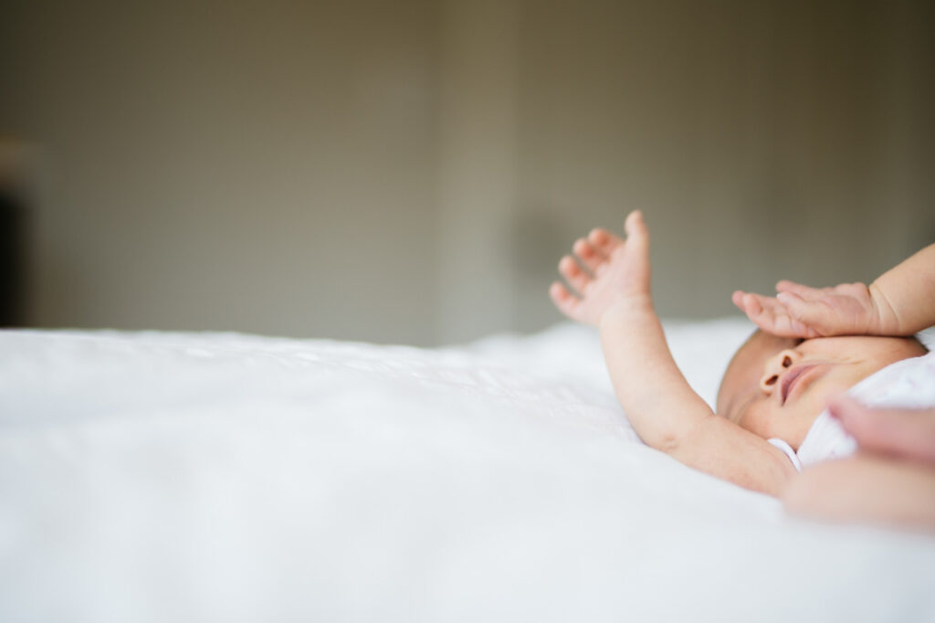 baby girl stretches newborn home session sf bay area