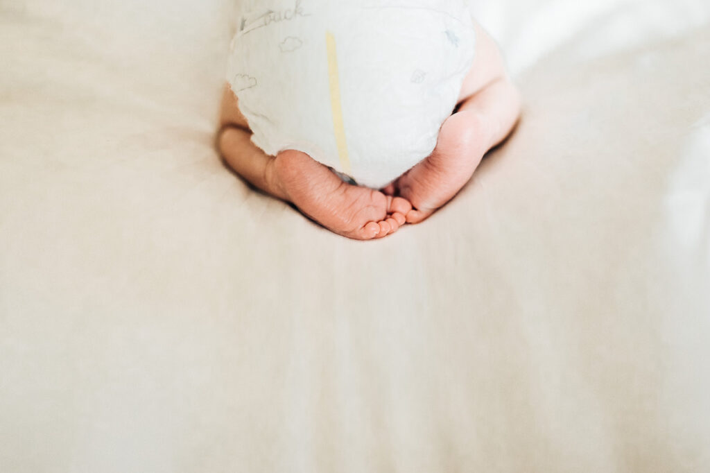 baby butt in diapers with cute feet newborn session sf bay area