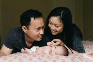 mom and dad bonding with baby son newborn home session sf bay area