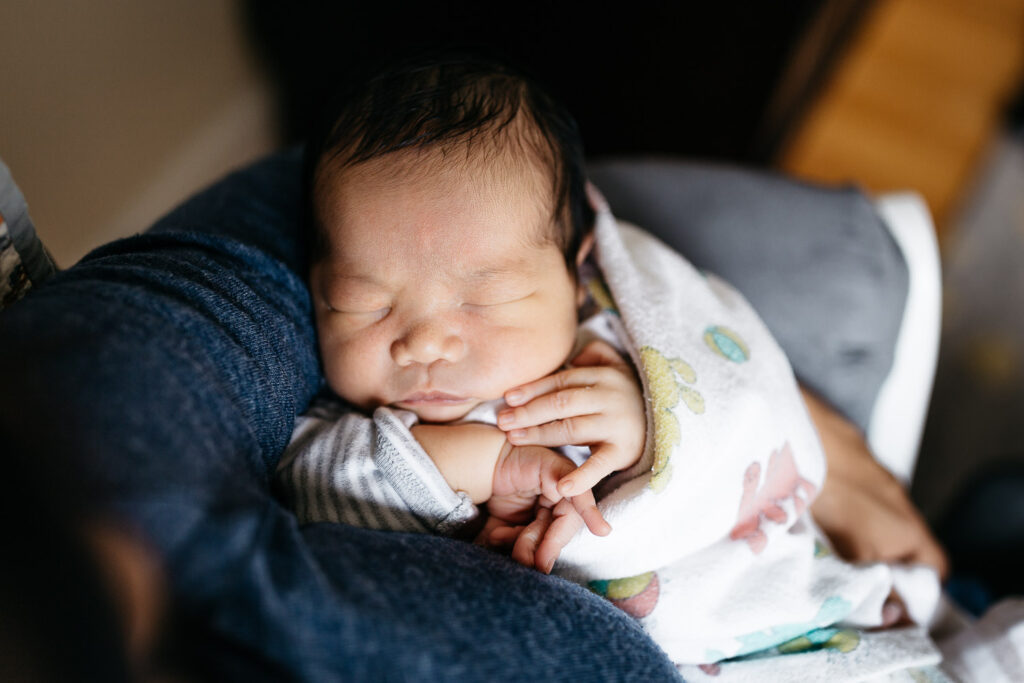 baby boy being held by mom newborn home session sf bay area