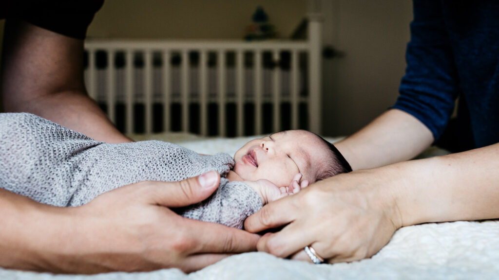 baby boy being held by mom and dad newborn home session sf bay area