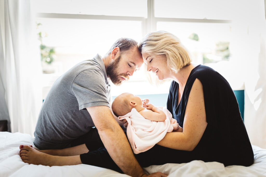 mom and dad bonding with bay girl newborn home session bay area alameda