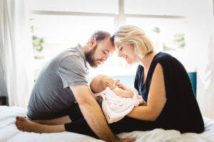 mom and dad bonding with bay girl newborn home session bay area alameda