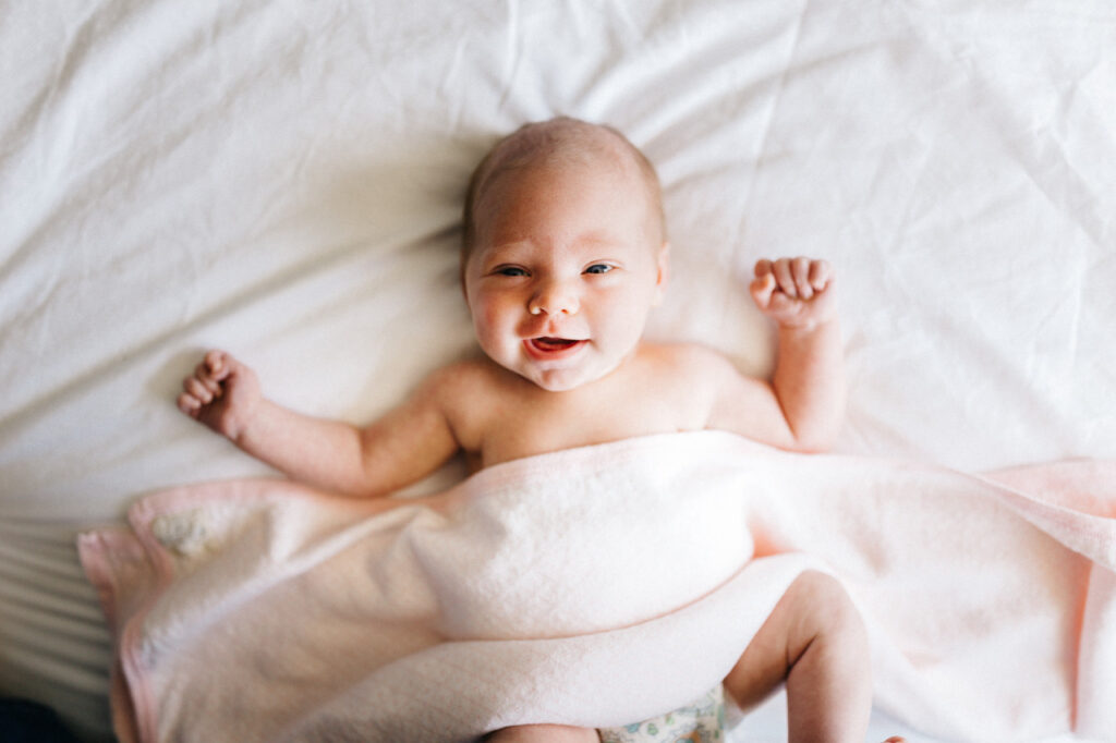 baby girl laughing newborn home session bay area alameda