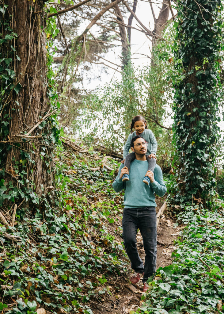 san-francisco-bay-area-family-photographer-carmen-dunham-photography-and-filmsIMG_7692-2 father carrying daughter on shoulders in forest area at lands end san francisco