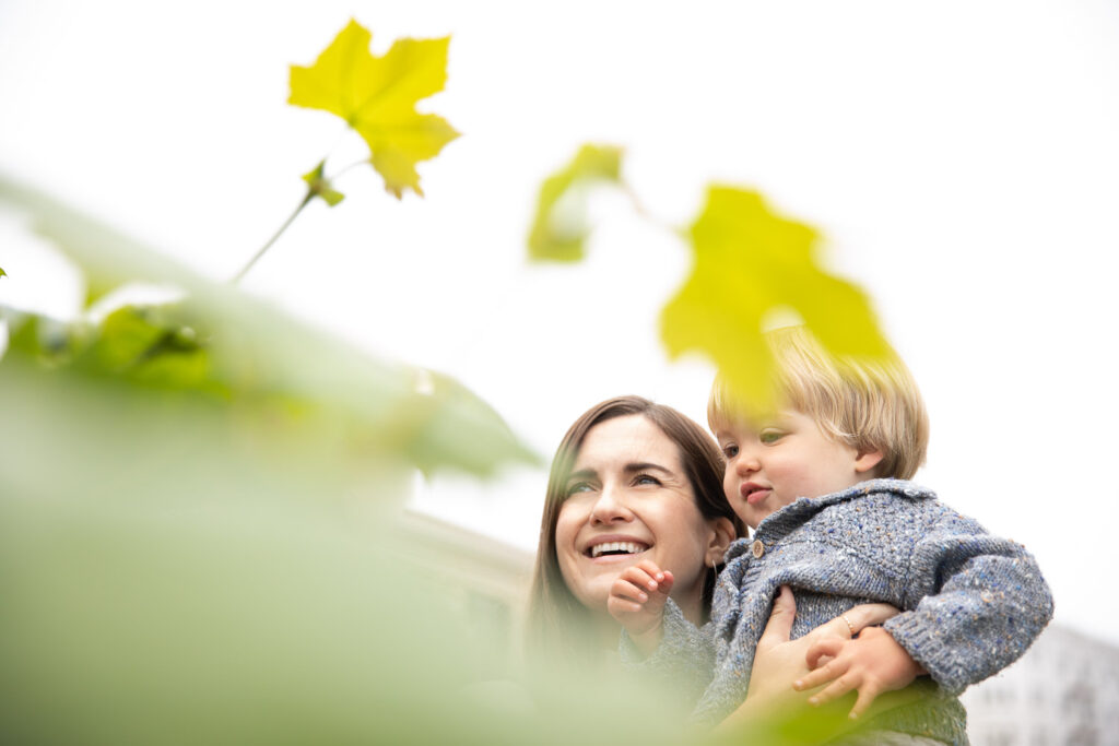 san-francisco-bay-area-family-photographer-carmen-dunham-photography-and-filmsIMG_4835-Edit mother holding son in alamo square park san francisco family session