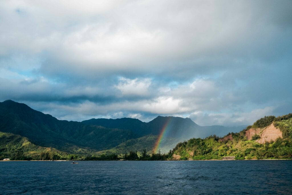 beautiful rainbow along the napali coast taken by boat