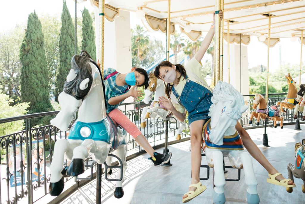 friends celebrating a birthday on the carousel at great america
