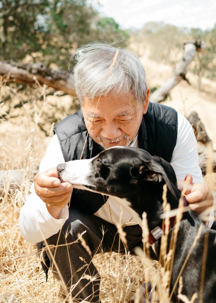 grandpa bonding with a whippet puppy at borges ranch in walnut creek
