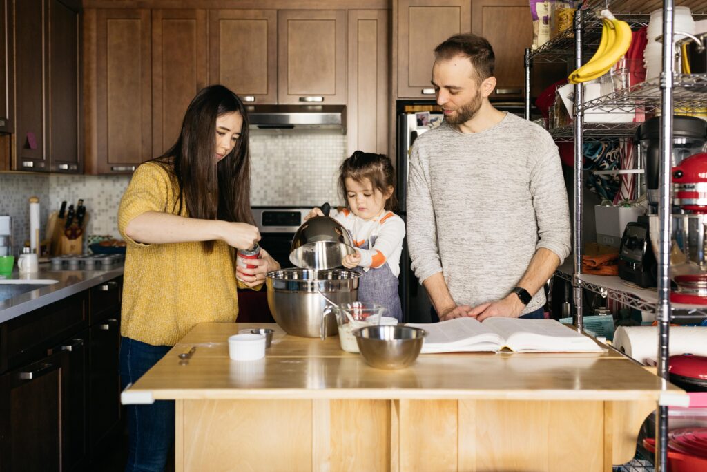 family baking together in the kitchen