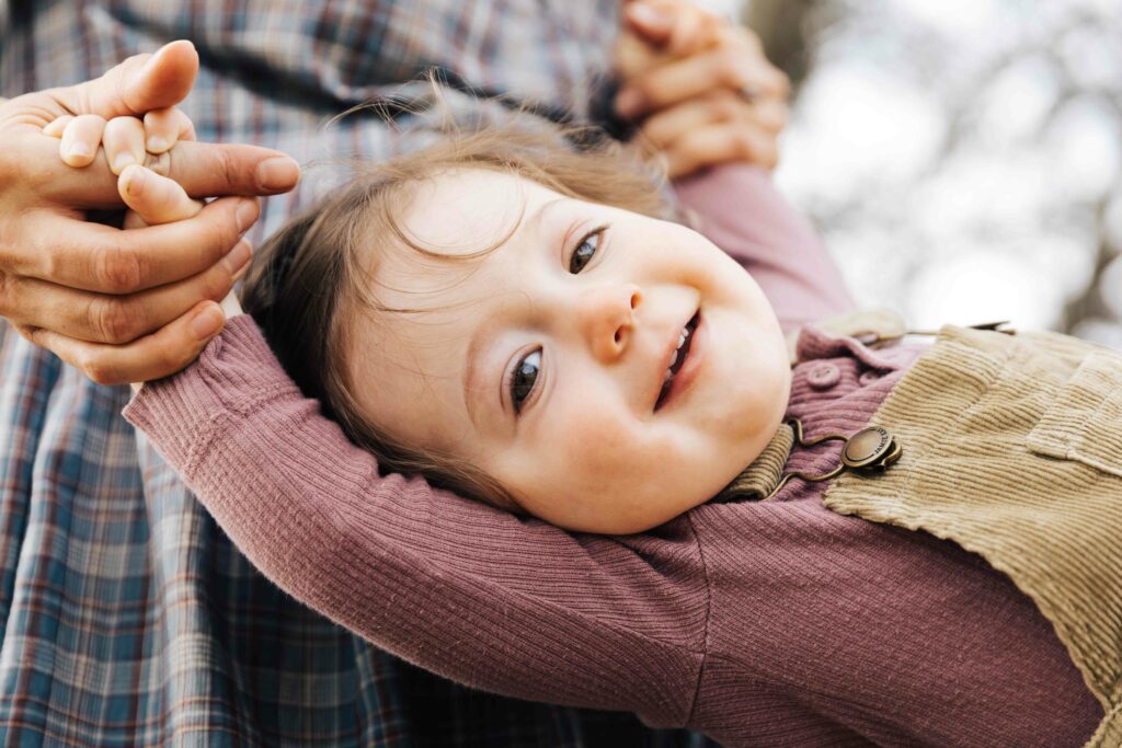 east-bay-family-photographer-IMG_0117-carmen-dunham-photography Young toddler being playful in mother's arms