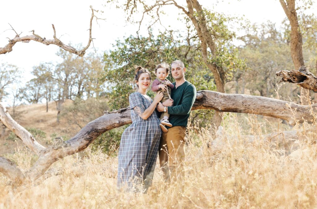 east-bay-family-photographer-IMG_0413-Edit-carmen-dunham-photography expecting family posing for photos in tall grass at Old Borges Ranch