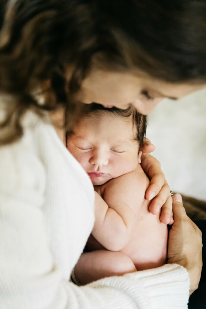 mother holding newborn son