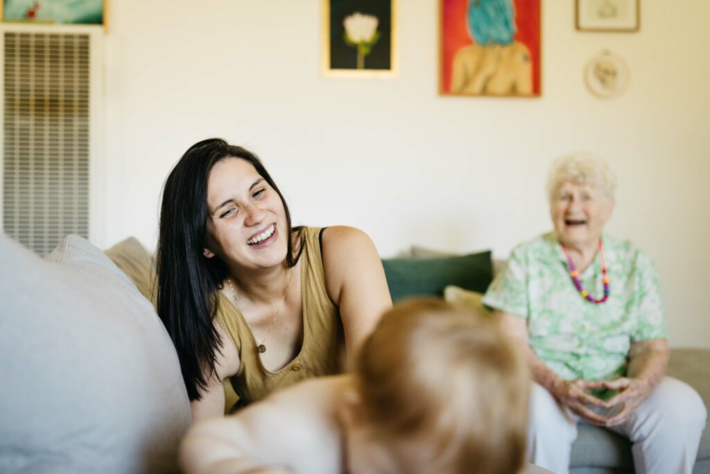 Family laughing in the living room.
