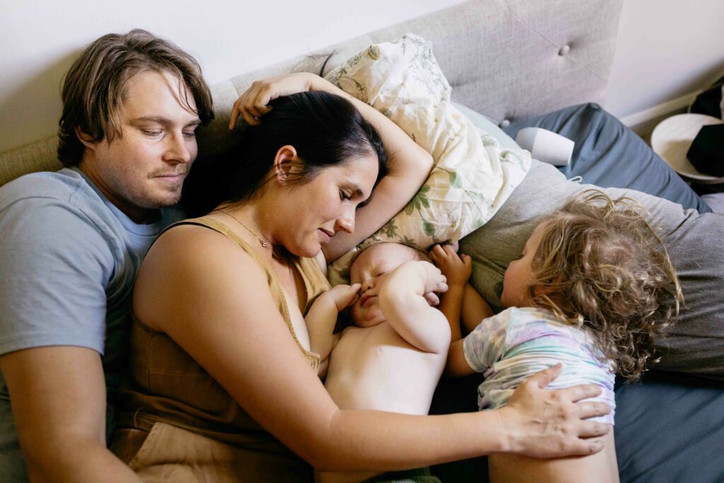 family cuddling in the bed post-nap.