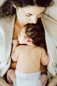 Mother kissing baby's head