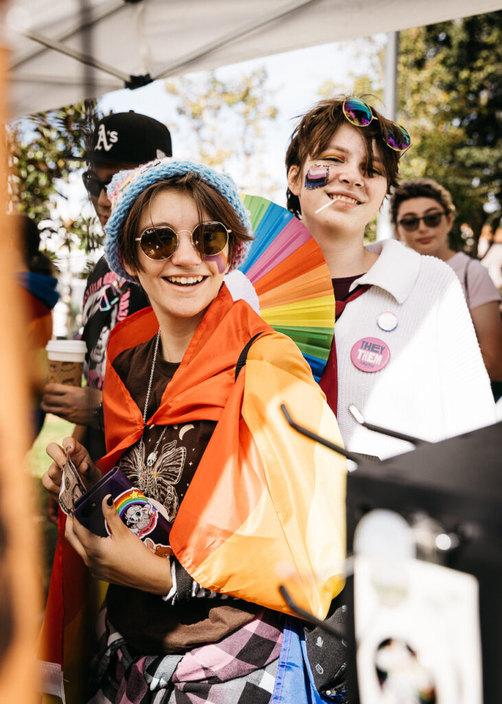 Teens visiting vendor tent at Alameda Pride 2023