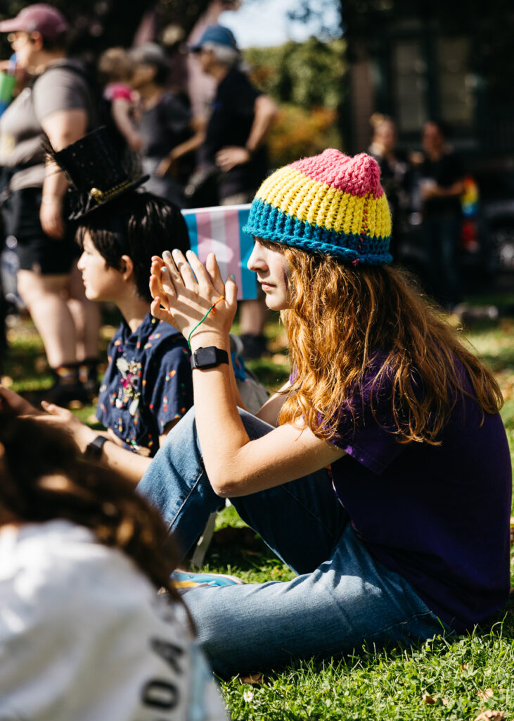 Teen clapping at Pride performance at Alameda Pride