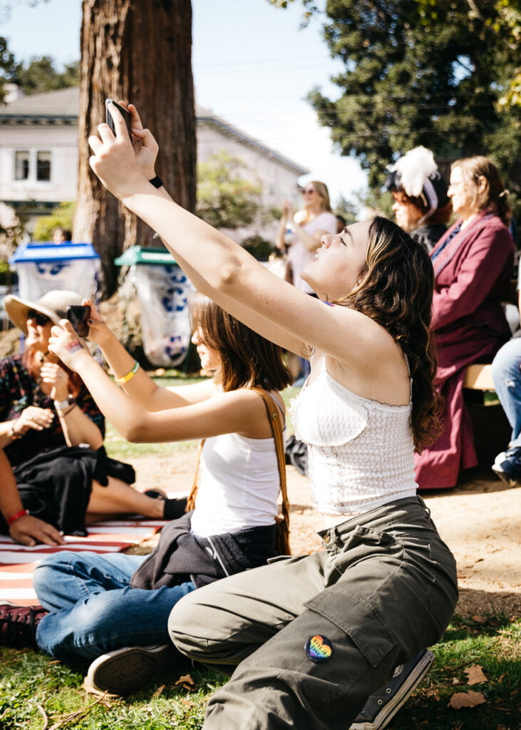 Teens capturing magic from Drag divas during performance at Alameda Pride