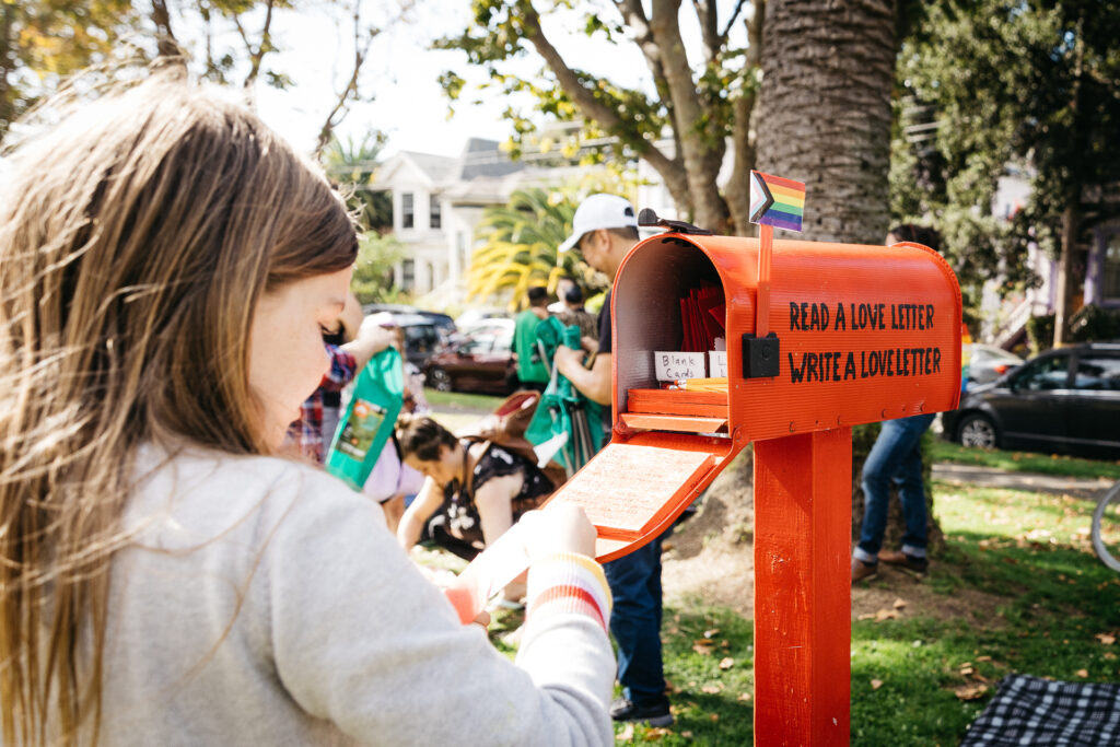 Kids reading and writing love letter at Alameda Pride 2023