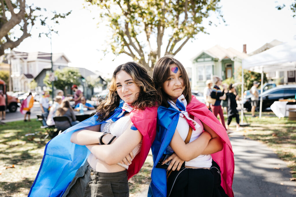 Teens wearing Pride flags at Alameda Pride 2023