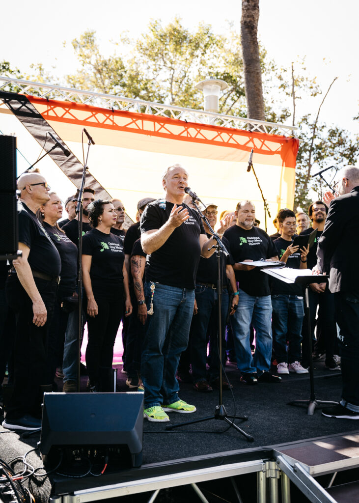 Oakland Gay Men's Chorus singing on main stage at Alameda Pride 2023