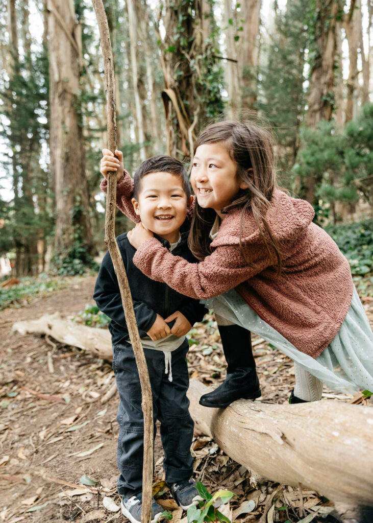 Brother and sister goofing around and being silly during a family photo session in San Francisco.