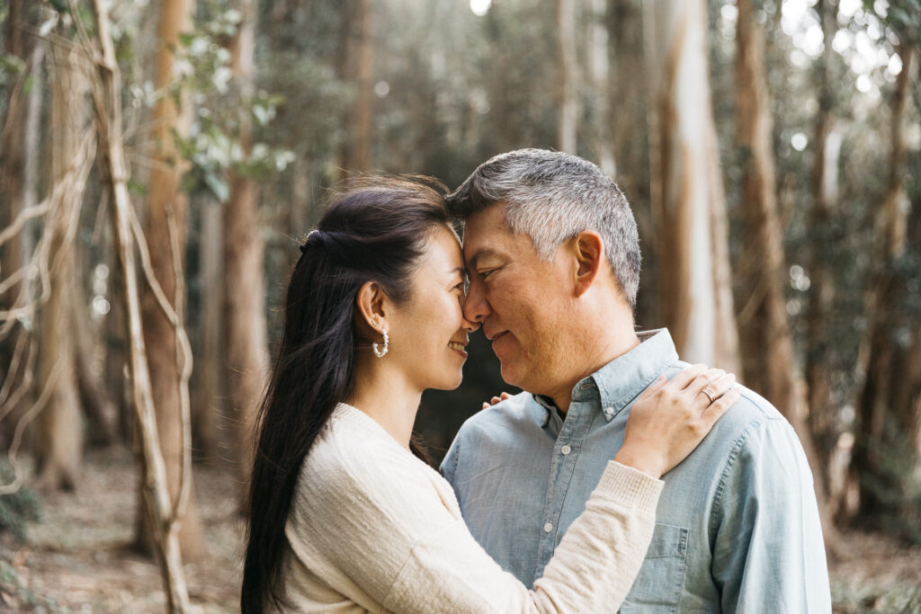 Mom and dad having a heart to heart moment during a family photo session in the Presidio