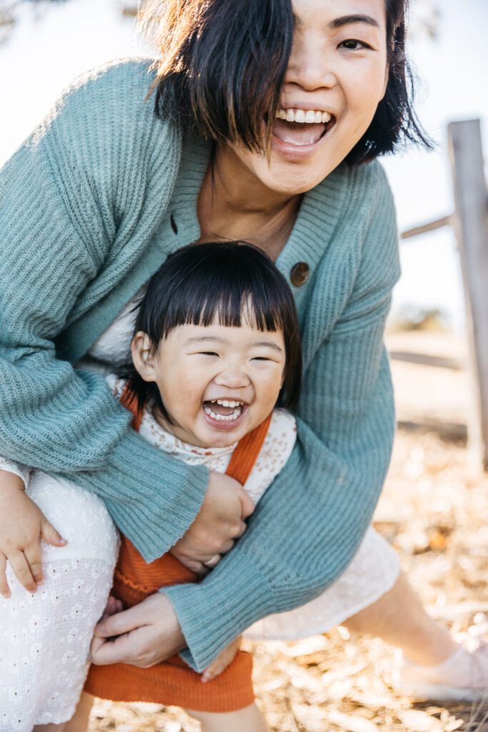 Lots of hugs and laughter during the maternity family session at Coyote Point.
