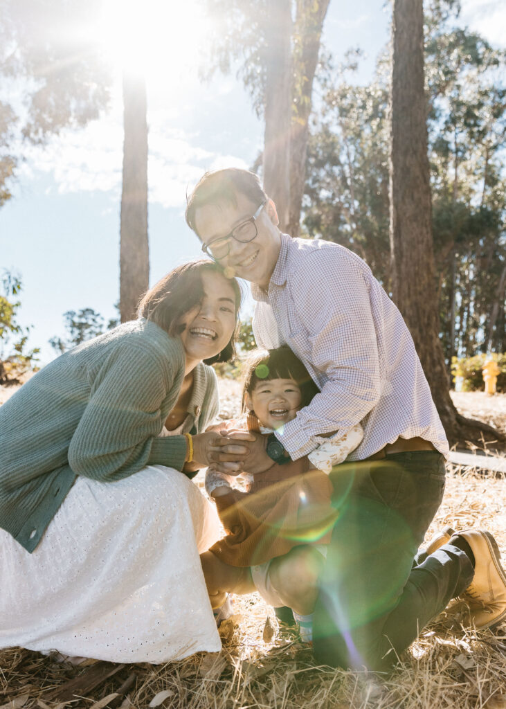 Lots of hugs and laughter during a family photo session at Coyote Point.