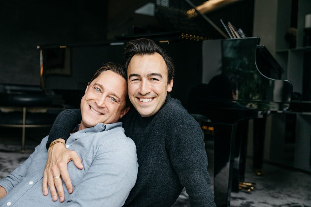 dads holding each other in the living room