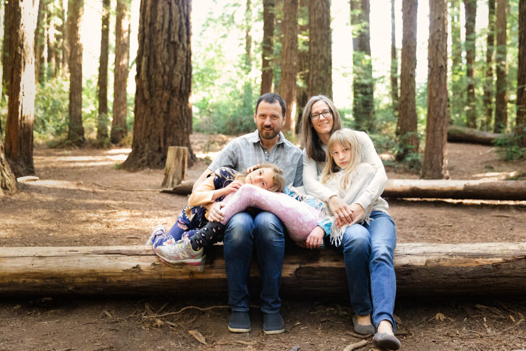 IMG_6989-Edit-Edit-Oakland-Joaquin-Miller-Family-Photography-Session-Carmen-Dunham-Photography Family sitting together among the redwood trees at Joaquin Miller Park.