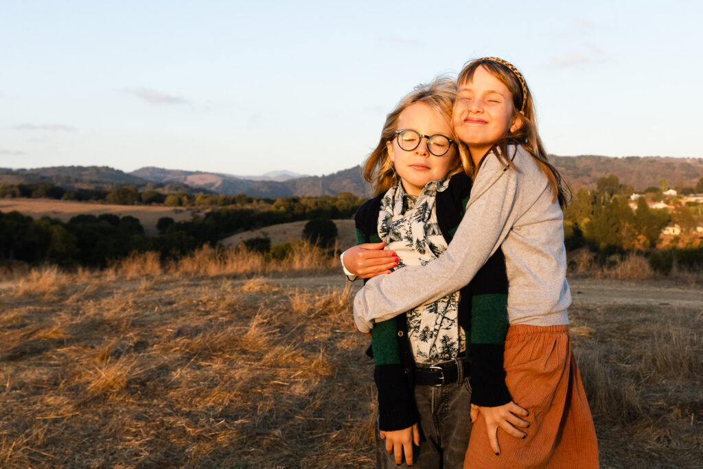 IMG_8628-Lake-Chabot-Castro-Valley-Family-Photographer-Carmen-Dunham-Photography Siblings hugging during a family photo session in Castro Valley.