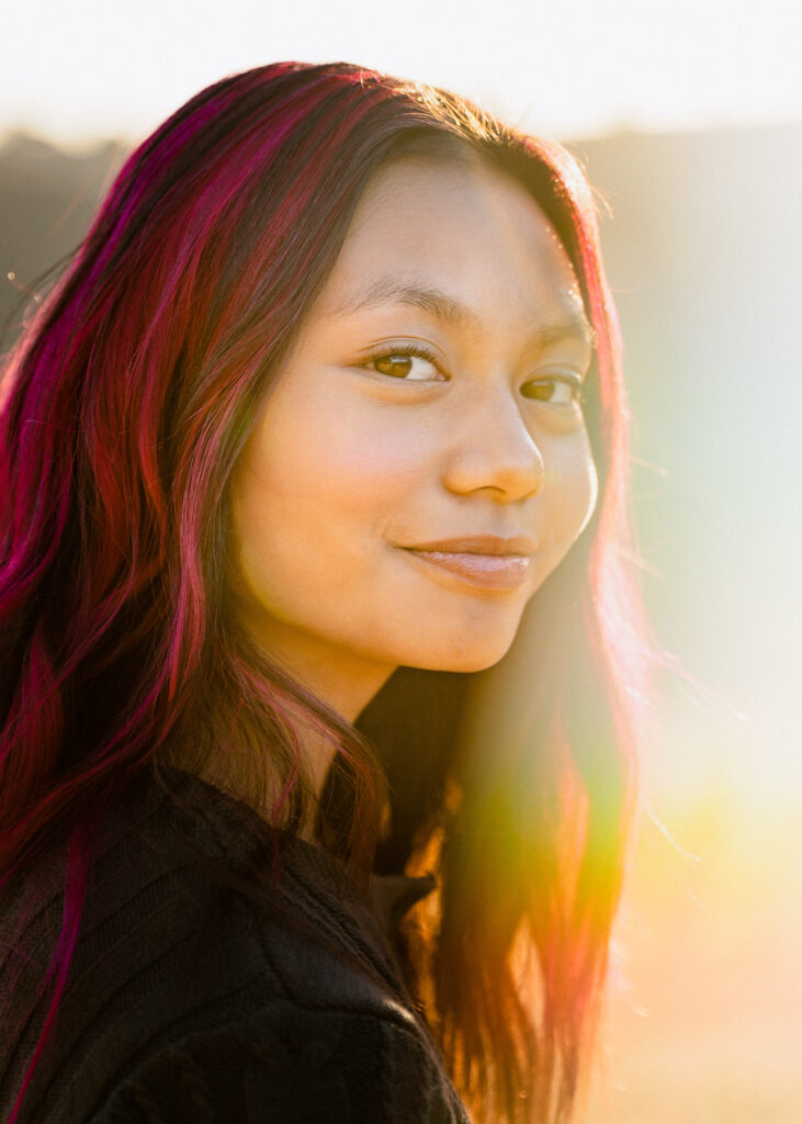 IMG_9673-Edit-Lake-Chabot-Castro-Valley-Family-Photographer-Carmen-Dunham-Photography Young girl looking over her shoulder during a family photo session at sunset in Castro Valley.