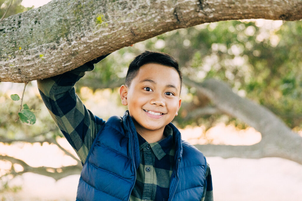 IMG_9785-Lake-Chabot-Castro-Valley-Family-Photographer-Carmen-Dunham-Photography Young boy leaning under a tree in the hills of Castro Valley.