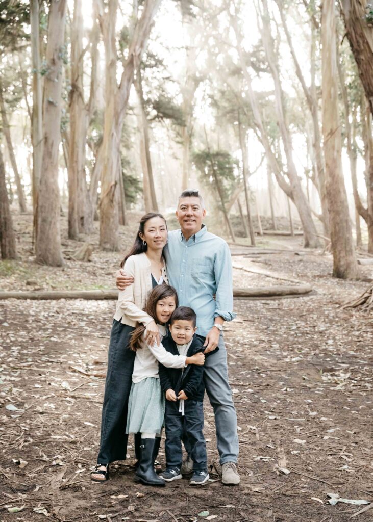 Family huddled together in the fog at Andy Goldsworthy's Wood Line.