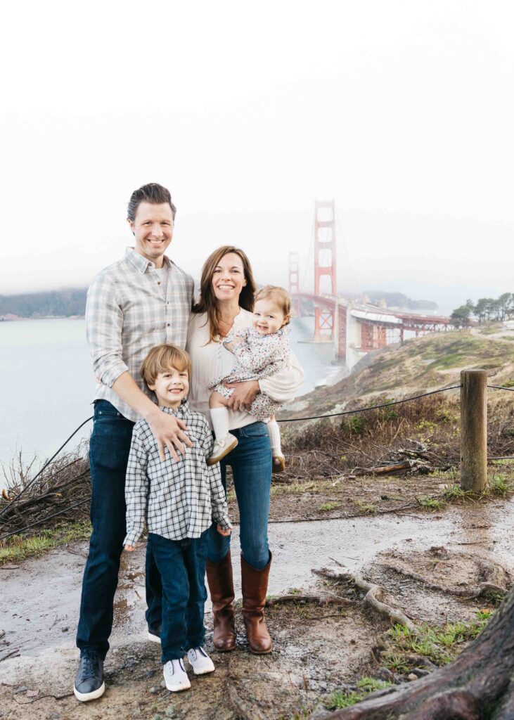 Family photos at the scenic overlook with the Golden Gate Bridge.