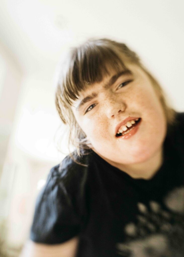 Teen girl is dancing and swaying to the music.