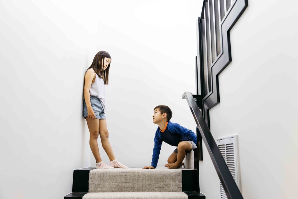 Older sister is giving her young brother the stare-down.